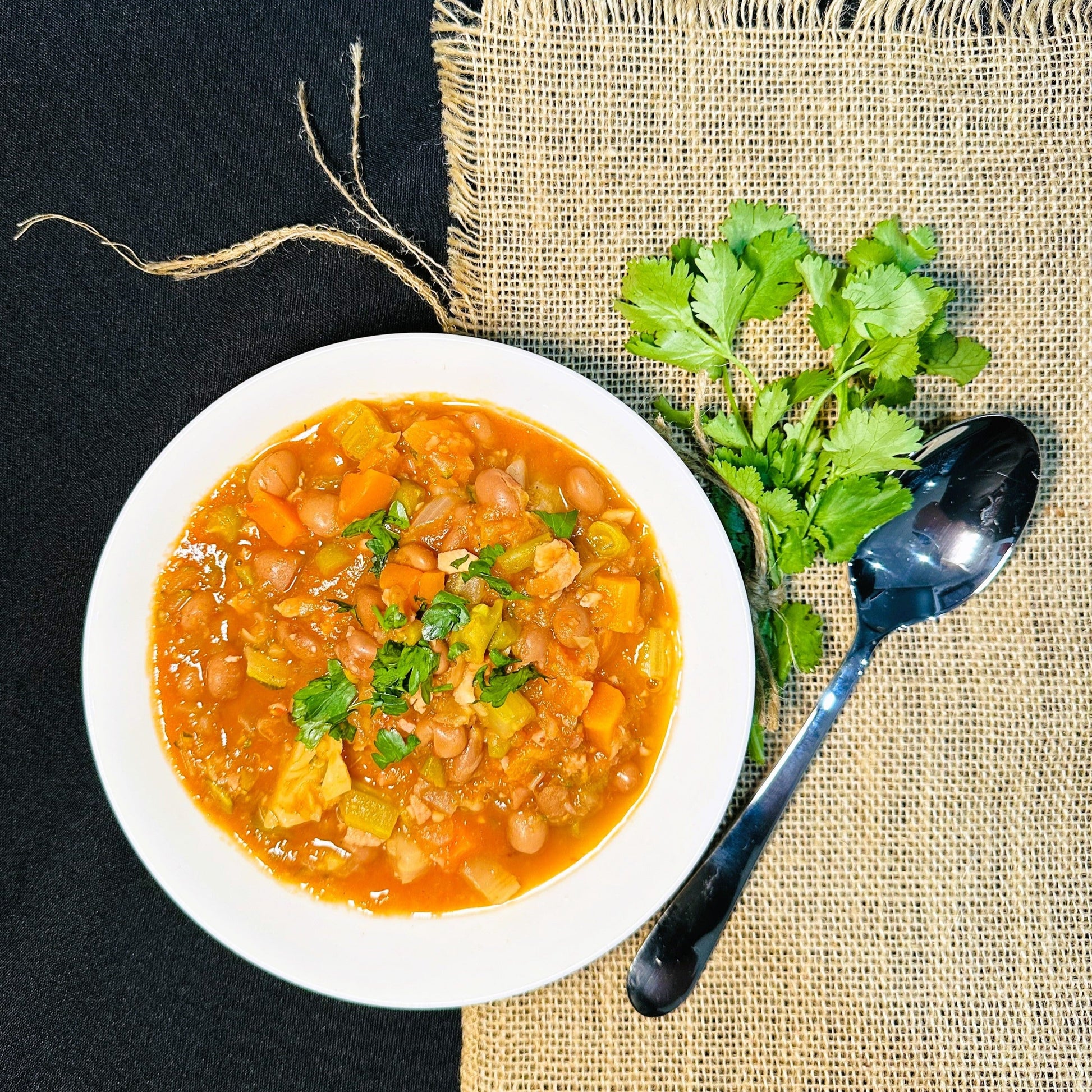 Hearty minestrone soup with bacon and beans and a hint of tomato