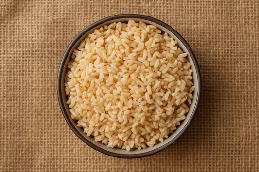 Image 1800 x 1800 of a bowl of brown rice from above with a hessian background