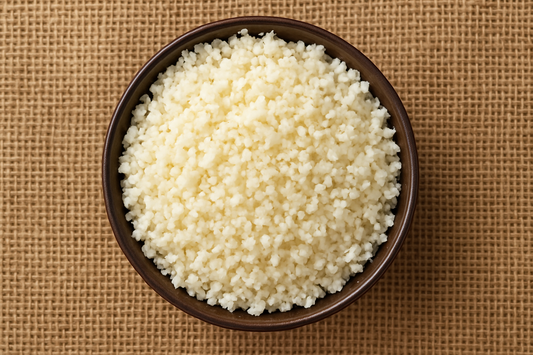 Image 1800 x 1800 of a bowl of cauliflower rice from above with a hessian background